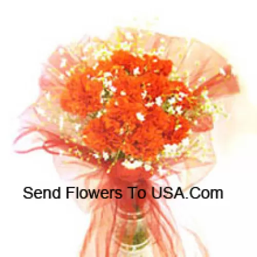 12 Orange Carnations With Some Ferns In A Vase