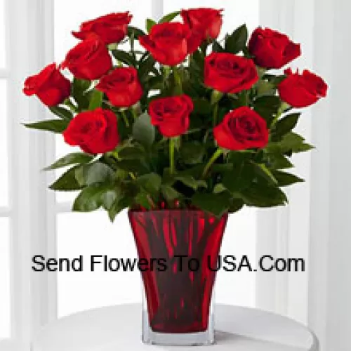 12 Red Roses With Some Ferns In A Vase